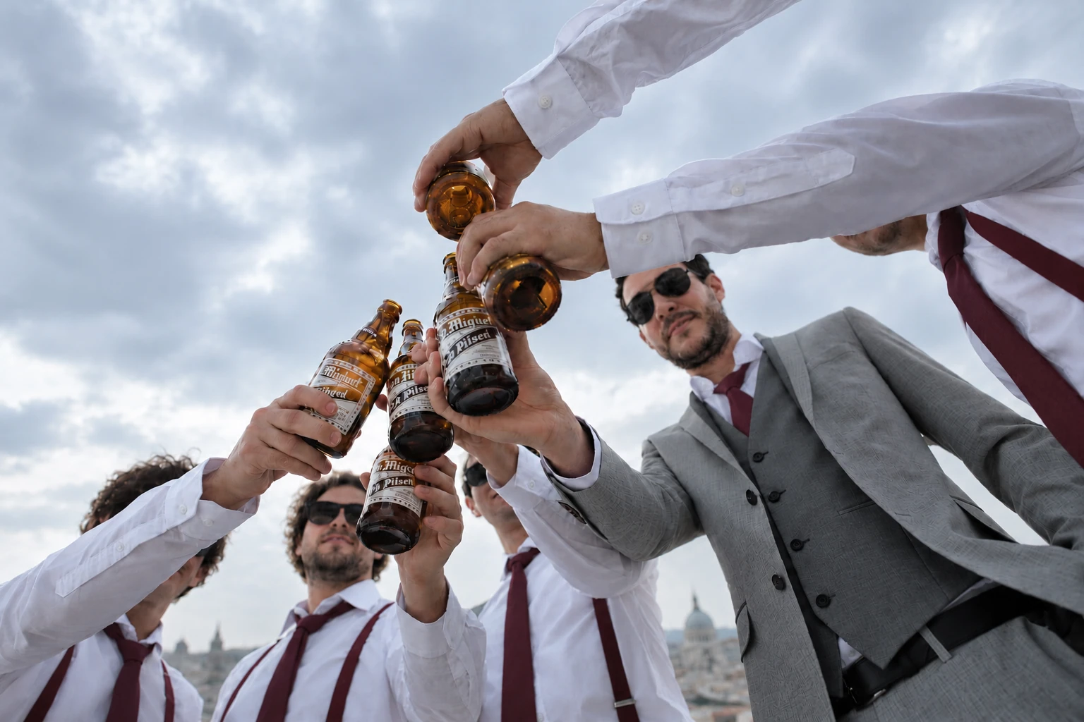 A group of men toasting with drinks